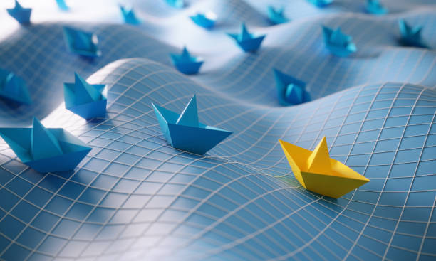3D-render van blauwe papieren bootjes en één geel bootje op de voorgrond, als symbool voor relaties en communicatie, leiderschap en individualiteit.